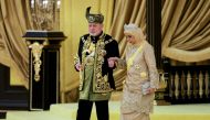 The seventeenth King of Malaysia, Sultan Ibrahim Sultan Iskandar and Queen Raja Zarith Sofiah Idris Shah walk near the throne during his coronation at the National Palace in Kuala Lumpur on July 20, 2024. (Photo by Hasnoor Hussain / Pool / AFP)