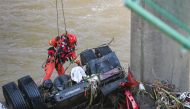 A rescuer works at the site of a bridge collapse in Zhashui County in Shangluo City, northwest China's Shaanxi Province, July 21, 2024. Xinhua/Zou Jingyi