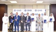 QNB and Chartered Institute of Marketing officials pose for a group photo.