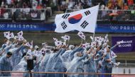 Athletes from South Korea's delegation sail in a boat along the river Seine during the opening ceremony of the Paris 2024 Olympic Games in Paris on July 26, 2024. (Photo by Dimitar Dilkoff / AFP)
 