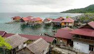 This photo taken on July 5, 2024 shows a general view of stilt houses at the village of the Bajau sea nomads in Pulau Papan in Sulawesi. (Photo by Jack Moore / AFP) 