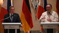 Philippine Defense Secretary Gilberto Teodoro (R) speaks while German Defence Minister Boris Pistorius listens during their joint press conference at a hotel in Manila on August 4, 2024. (Photo by Ted ALJIBE / AFP)