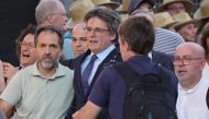 Catalonia's exiled separatist leader Carles Puigdemont (C) arrives with his lawyer Gonzalo Boye (R) and Junts per Catalunya's General Secretary Jordi Turull (3rd-L) as his hardline separatist JxCAT party has scheduled a welcome ceremony, ahead of an investiture vote at the Parliament of Catalonia, in Barcelona on August 8, 2024. (Photo by Cesar Manso / AFP)
