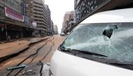 (FILES) A general view of a damaged road in Johannesburg on July 20, 2023, following an unexplained explosion which occurred during rush hour on July 19, 2023. (Photo by Luca Sola / AFP)

