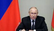 In this pool photograph distributed by Russian state owned agency Sputnik, Russia's President Vladimir Putin chairs a meeting regarding the situation in the Kursk region, in his residence in Novo-Ogaryovo outside Moscow, on August 12, 2024. (Photo by Gavriil GRIGOROV / POOL / AFP)