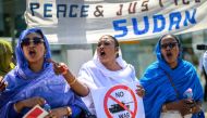 Women shout slogans as they take part to a demonstration on the opening day of Sudan ceasefire talks, in Geneva, on August 14, 2024. US-sponsored talks on agreeing a ceasefire in the devastating conflict in Sudan kicked off in Switzerland, despite the Sudanese government staying away. (Photo by Fabrice COFFRINI / AFP)
