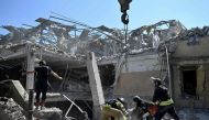 Ukrainian emergency services carry out a search and rescue operation among the rubble of a destroyed hotel after a strike in the town of Kramatorsk, Donetsk region on August 25, 2024. (Photo by Genya SAVILOV / AFP)
