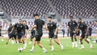 Qatar players attend a training session at Khalifa International Stadium yesterday.