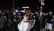 NYPD officers perform security checks as people arrive for the annual street party J'ouvert on September 2, 2024 in New York City. (Photo by Adam Gray / GETTY IMAGES NORTH AMERICA / Getty Images via AFP)
