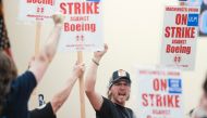 Union members react as Aerospace Machinists District 751 President Jon Holden (out of frame) announces that union members rejected a proposed Boeing contract and will go on strike, following voting results at their union hall in Seattle, Washington, on September 12, 2024. Photo by Jason Redmond / AFP.