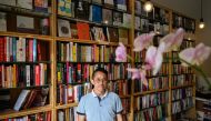 Yu Miao, owner of JF Books, poses for a portrait at his bookstore in Washington, DC, on September 6, 2024. (Photo by Drew Angerer / AFP)