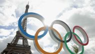 This photograph shows the Olympic rings displayed in front of the Eiffel Tower in Paris, on September 27, 2024. (Photo by Thomas SAMSON / AFP)