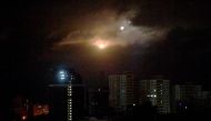 Drones explode as they are being destroyed by Ukrainian air defence during mass night strike to Ukrainian capital of Kyiv on September 30, 2024. (Photo by Sergei SUPINSKY / AFP)
