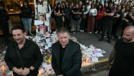 Geoff Payne (C), the father of One Direction pop singer Liam Payne, walks in front of the place where fans paid tribute to his late son outside the CasaSur Hotel in Buenos Aires on October 18, 2024. (Photo by Juan Mabromata / AFP)