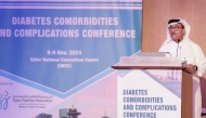 Dr. Abdullah Al Hamaq giving a speech at the event.