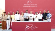 The connections of Hamam celebrate with their trophies after winning the Lekhraib Cup.