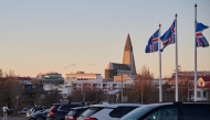 Icelandic national flags are seen flying outside as the Hallgrimskirkja church is seen in the background, in Reykjavik, Iceland, on November 30, 2024. (Photo by Halldor Kolbeins / AFP)
