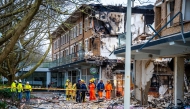 Rescuers work on the site where an explosion and fire destroyed an apartment block, killing at least six people, on the Tarwekamp in The Hague on December 9, 2024. Photo by Josh Walet / ANP / AFP
