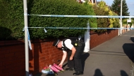 A police officer lays floral tributes brought by wellwishers on Hart Street in Southport, northwest England, on July 29, 2024, following a knife attack. (Photo by Darren Staples / AFP)