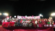 QMMF Executive Director and CEO of Lusail International Circuit Amro Al Hamad poses for a photo with the contingents of participating nations during the opening ceremony of MENA Karting Championship Nations Cup 2024 yesterday. 