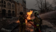 Ukrainian firefighters try to extinguish a fire on the site of a Russian missile attack in Kyiv on December 20, 2024, amid the Russian invasion in Ukraine. (Photo by Roman PILIPEY / AFP)