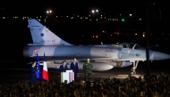 France's President Emmanuel Macron (second left) gives a speech to French soldiers at an airbase in Djibouti on December 20, 2024. (Photo by Nicolas Messyasz / POOL / AFP)
