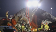File: Firefighters and rescue personnel work near the scene where a Jeju Air Boeing 737-800 series aircraft crashed and burst into flames at Muan International Airport in South Jeolla Province, some 288 kilometers southwest of Seoul on December 29, 2024. (Photo by Yonhap / AFP)

