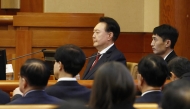 South Korea’s impeached President Yoon Suk Yeol (C) attends the fourth hearing of his impeachment trial over his short-lived imposition of martial law at the Constitutional Court in Seoul on January 23, 2025. (Photo by JEON HEON-KYUN / POOL / AFP)
