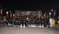 QRC Director General Sheikh Jabor bin Khalid Al Thani poses with the drivers.