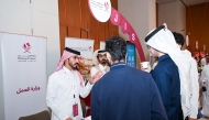 Visitors interacting at Ministry of Labour Booth at the fair. 