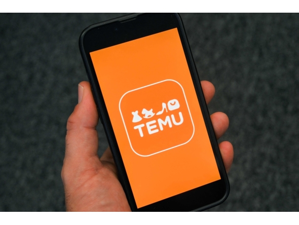  This photo illustration shows the logo of fast fashion e-commerce company Temu displayed on a mobile phone in Brussels, on November 4, 2024. Photo by Nicolas TUCAT / AFP