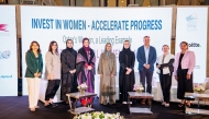 Vice Chairwoman of QBWA Aisha Alfardan pose for a group photo with other officials.