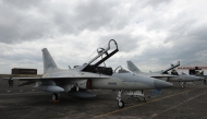 (FILES) In this photo taken on November 28, 2015 South Korean-made FA-50 multirole light fighter aircrafts with tail numbers 002 (L) and 001 (R) for the Philippine Air Force are parked on the tarmac shortly after arriving at Clark Air Base in Angeles City, Pampanga province. (Photo by Ted ALJIBE / AFP)
