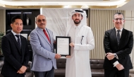 A GWC official receiving the ISO certificate.