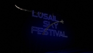 Drones perform a light show over Lusail City during the Lusail Sky Festival as part of Qatar's Eid al-Fitr celebrations on April 4, 2025. (Photo by Karim JAAFAR / AFP)