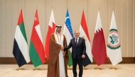 President of Uzbekistan H E Shavkat Mirziyoyev with Speaker of the Shura Council H E Hassan bin Abdullah Al Ghanim.