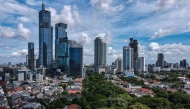 This aerial picture shows skyscrapers in Jakarta's business district on April 14, 2025. (Photo by BAY ISMOYO / AFP)
