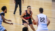 Al Rayya's Tyler James Lee Harris (left) attempts to dribble past an Al Wakrah player.