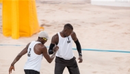 Qatar’s Ahmed Tijan (left) and Cherif Younousse celebrate.