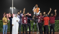 The connections of Mutamarrid celebrate their victory. PICS: Juhaim/QREC
