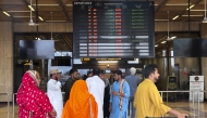 Passengers wait at Jinnah International airport after all domestic and international flights were cancelled in Karachi on May 7, 2025. Photo by Asif HASSAN / AFP
