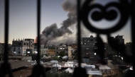 Smoke rises following an Israeli strike in the Bureij refugee camp in the centre of the Gaza Strip, on May 6, 2025. Photo by Eyad BABA / AFP