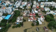 An aerial view shows a flooded locality following heavy rainfall in Bengaluru on May 19, 2025. (Photos by Idrees Mohammed / AFP)
