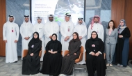 Officials pose for a group photo during the visit to Commercial Bank Plaza.