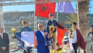 Qatar's Tamim Khalid (right) celebrates with other podium winners.