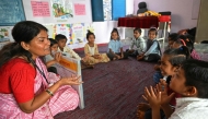 In this photograph taken on April 8, 2025, teacher Jashoda Khokariya teaches students inside the classroom at Kalyanpur village. (Photo by Money Sharma / AFP) 