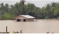 Flood waters surround a building following a heavy storm in Datu Odin Sinsuat, Maguindanao, Philippines October 28, 2022 in this still image obtained from a social media video. Alizain A. Tahir/via REUTERS