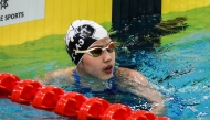 China's Yu Zidi reacts after finishing the women's 200 meters freestyle semifinal at the 2025 National Swimming Championships in Shenzhen on May 19, 2025. (Photo by AFP) 