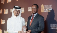 A Commercial Bank official receiving an award.