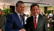 US Secretary of Defense Pete Hegseth (L) is greeted by his Singaporean counterpart Chan Chun Sing (R) at a ministerial roundtable during the Shangri-La Dialogue Summit in Singapore on May 31, 2025. (Photo by Mohd Rasfan / AFP)